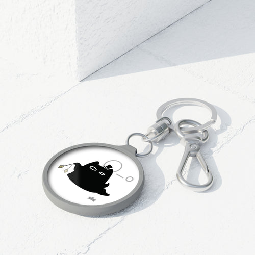 Lord of the Mysteries Cat Keyring - Black cat with monocle design, angled view on marble surface
